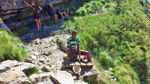 Rubin playing the xylophone 3/4th of the way up the mountain.   See the climber, Tom and Marian included taking advantage of the limited shade!