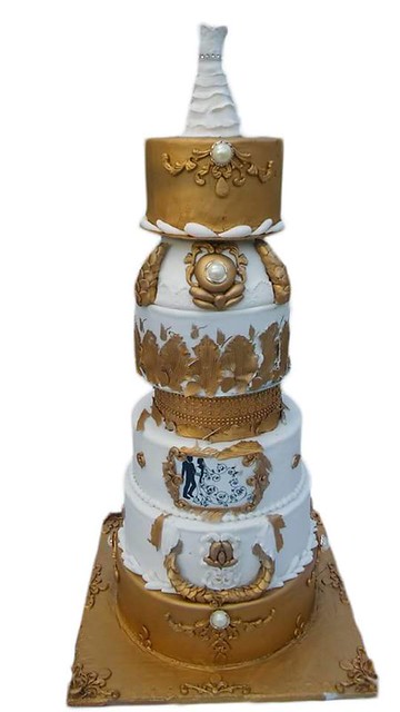 Gold and White Wedding Cake by Kassy Missy Ndakasha