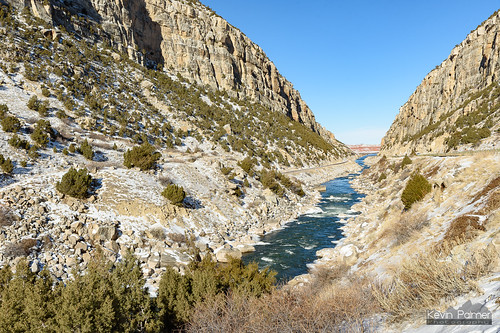 winter december snow sunny sunshine blue sky nikond750 wyoming thermopolis highway20 cliffs windrivercanyon bighornriver water flowing railroad track boulders