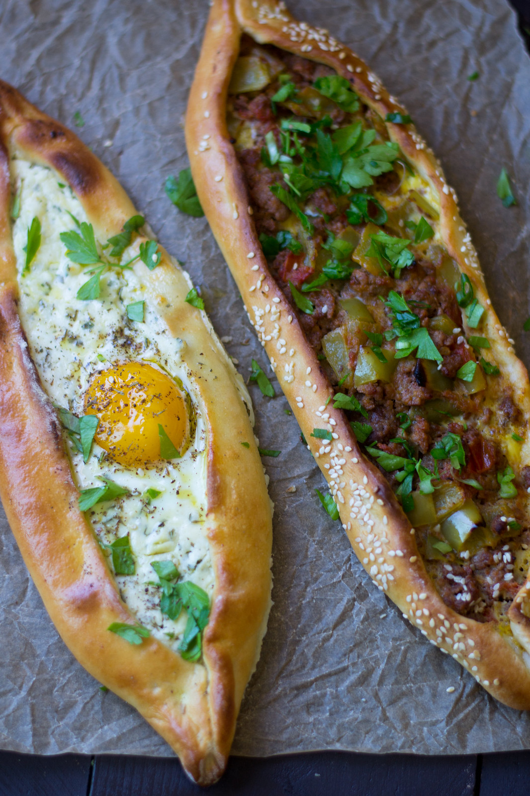 Turkish Pide (aka pizza) is a Turkish comfort food favorite! Here are 2 different fillings, one with meat and peppers and the other with cheese and egg.