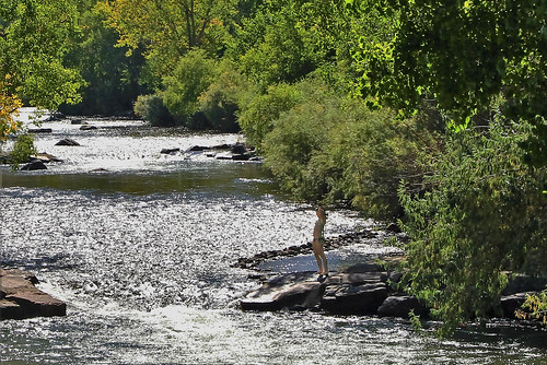 whitewater current stream river girl woman youngwoman swimmer diver swimsuit clearcreek sun reflection golden colorado jannagalski jannagal white green trees