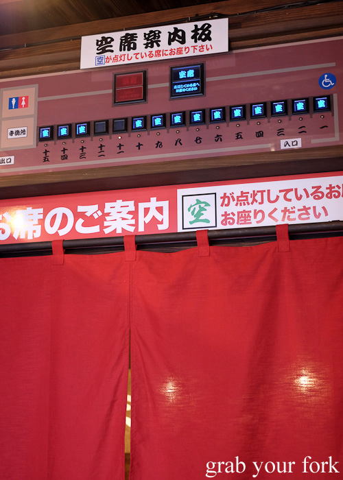 Booth vacancy lights at Ichiran, Hakata, Fukuoka, Japan