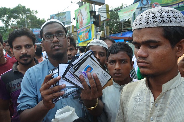 Hajjan Ahmed shows Madrasa students identity card