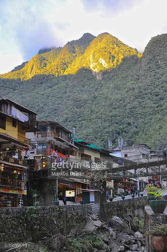 houses people peru vertical buildings outdoors town day small pueblo sunny jungle tropical machupicchu gettyimages endofday