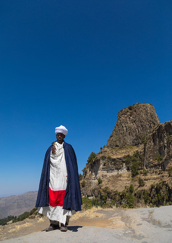 adult africa africanethnicity amhararegion ashetenmariam ashetonmaryam bluesky celebration christianity church clearsky clothing colourpicture copyspace cross developingcountry devotion eastafrica ethio17595 ethiopia ethiopian fulllenght highlands hill hornofafrica lalibela lookingatcamera men monastery onemanonly oneperson people priest religion religious semienwollo timkat traditionalclothing unescoworldheritagesite vertical et