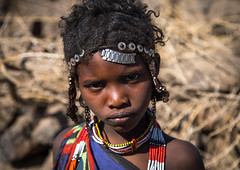 Issa tribe child girl with traditional hairstyle, Afar region, Yangudi Rassa National Park, Ethiopia
