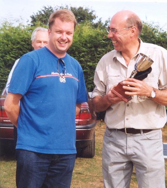 Graham Heels presents the race winner’s trophy to Chris Forrest at Snetterton in 2003.