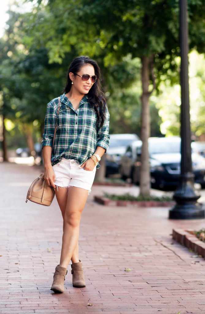 cute & little blog | green plaid shirt, white distressed shorts, ankle booties, brown aviators, bucket bag | summer fall outfit