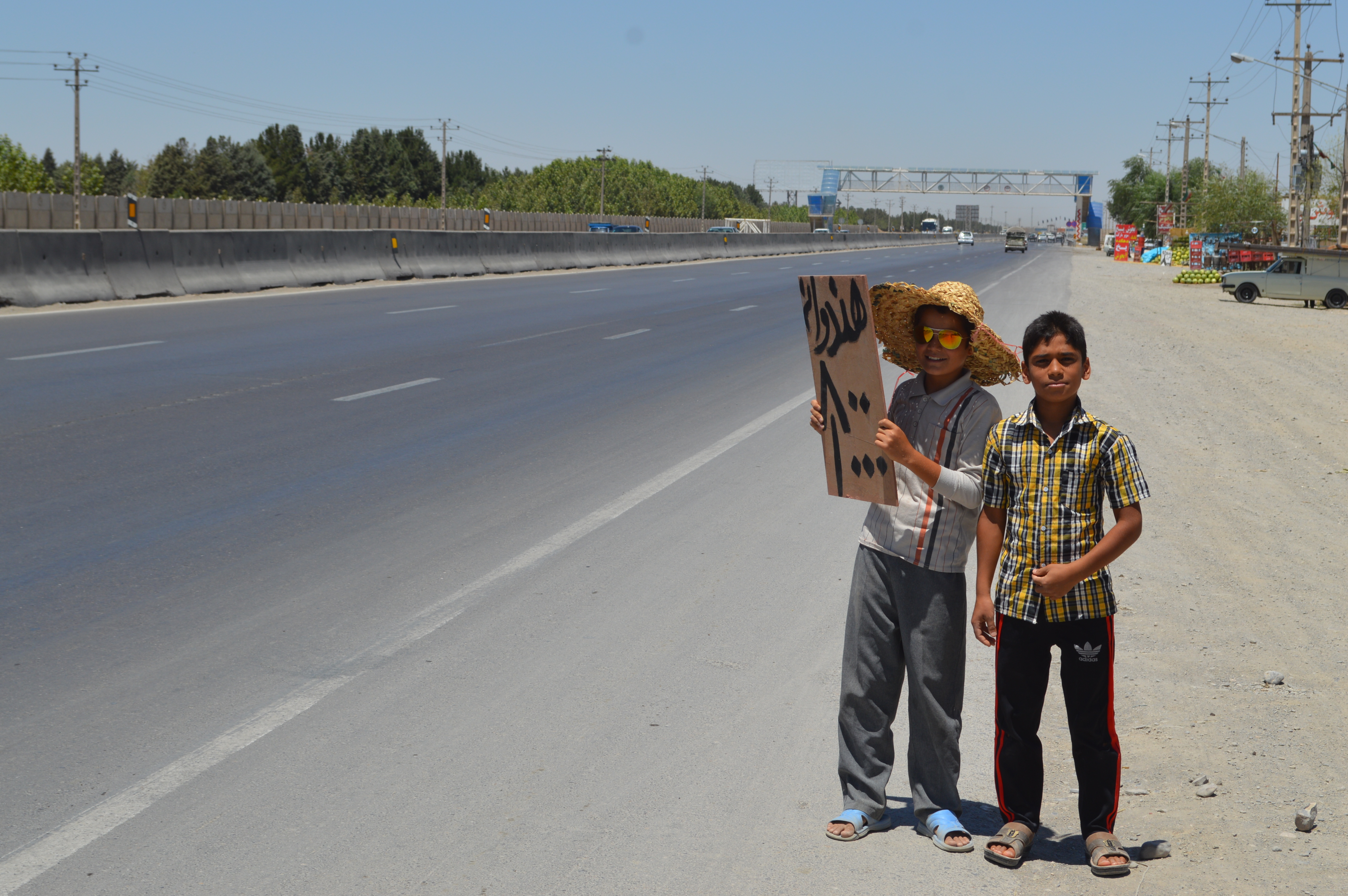 Persian boys beside the road