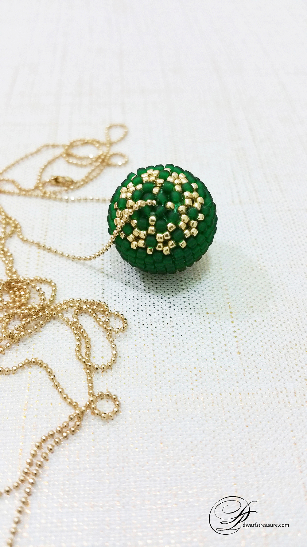 long ball chain necklace with graceful green and gold beaded ball pendant