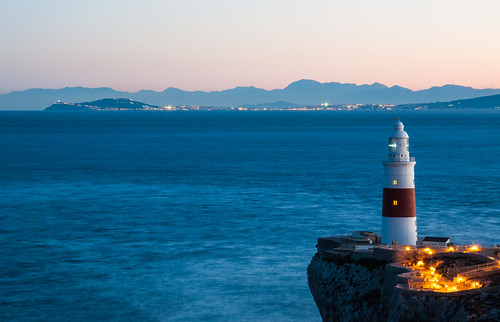 europe europapoint europa lighthouse cliff view strait straitofgibraltar gibraltar sea ocean atlantic medellin morocco africa ceuta spain mountains range ridge mountain coast coastline illuminated lights red white blue sky nikon d90 winter january 2017 long exposure rif clear continents continental divide meeting overseas territories territory colonies horizon land twilight connected distance travel trinity house