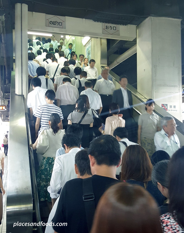 tokyo rush hour commuters rushing on stairs
