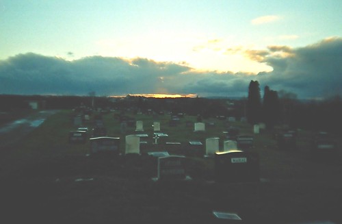 sunset sky sun cemetery clouds golden lomo lca shine dusk albaluminis over december2005 curtains glimmer bigcalm nuanc glimmerglowshimmershine endoftheday