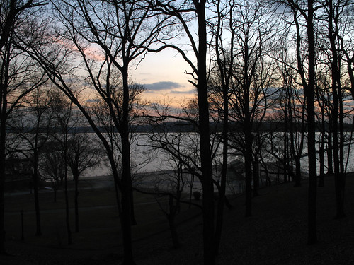 beach hempstead harbor sunset clouds orange purple sky water dusk winter branches naked tree leafless bare silhouette outline shadow dark grass park bench oysterbay jetty underexposed
