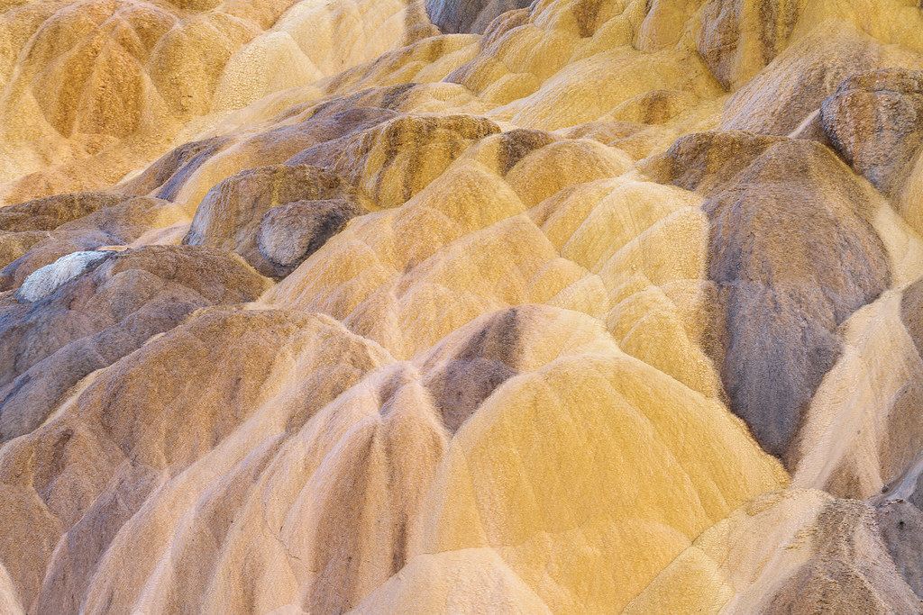 Orange-colored mineral deposits in Mammoth Hot Springs in Yellowstone National Park