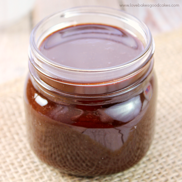 Homemade Chocolate Sauce in a glass jar close up.
