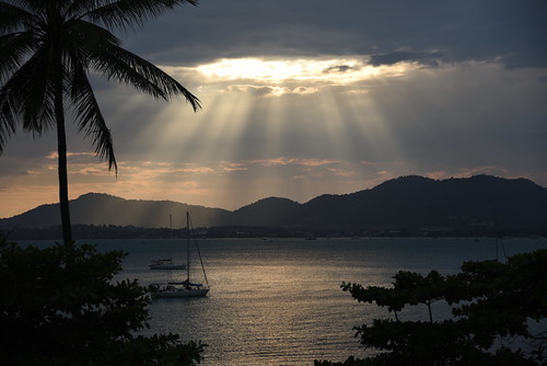sunset approaches over andaman sea clouds rays vessels boats from bythesea balcony cloudy but warm