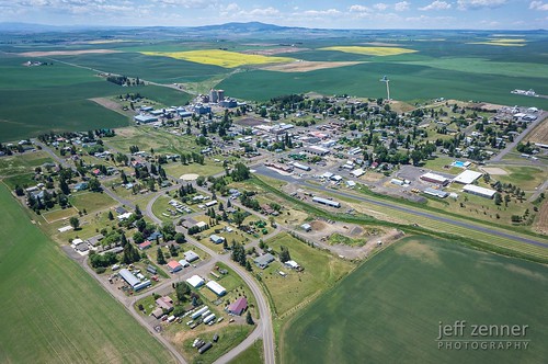 aerial agriculture canola farm farming field fields idaho landscape nezperce rural town view wheat ag city community country countryside green home homestead perspective skyline small yellow