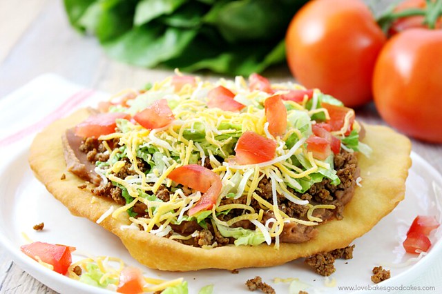 Change up your boring dinner routine with this easy recipe for Fry Bread Tacos (aka Navajo Tacos). A quick and simple bread dough is quickly fried and then topped with your favorite taco toppings!