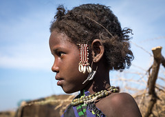 Side view of an Issa tribe child girl with traditional hairstyle, Afar region, Yangudi Rassa National Park, Ethiopia