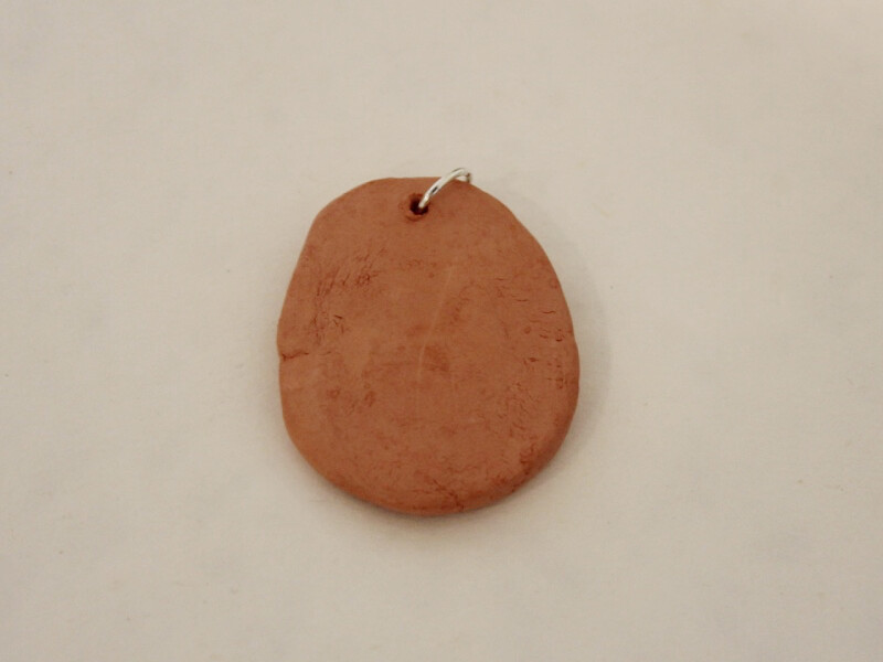 back of clay pendant