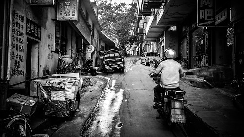 china street bw hot horizontal alley asia phone motorbike stores humid jiangxi ganzhou 33c