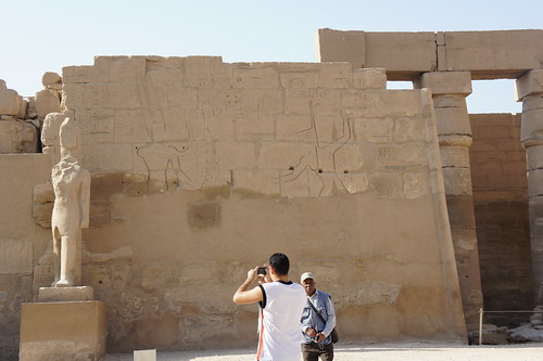 Photographing headless statue at Karnak of Egypt