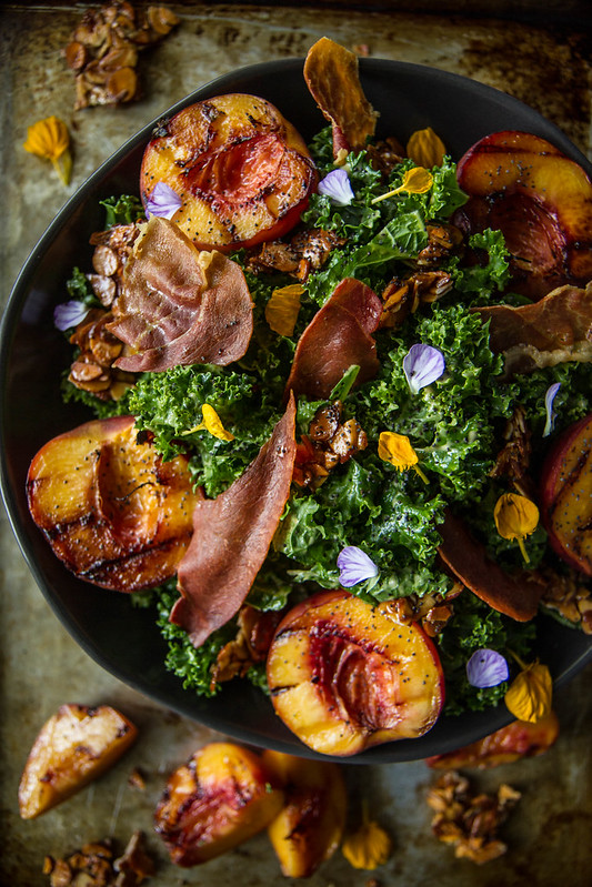 Grilled Peach Kale Salad with Honey Almond Clusters, and Crispy Prosciutto