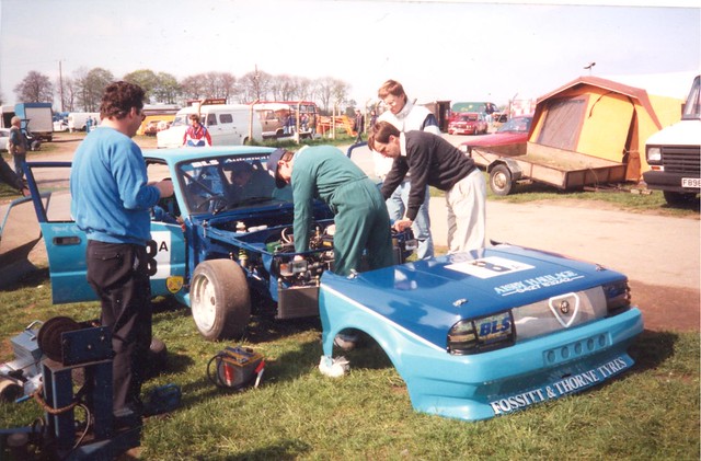 A 1992 paddock scene at Cadwell  featuring the BLS team and Mark Riddle’s supercharged 33.