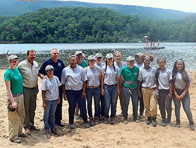 Governor McAuliffe, DCR Director Clyde Cristman, and the Douthat State Park Youth Conservation Corps on Douthat beach.
