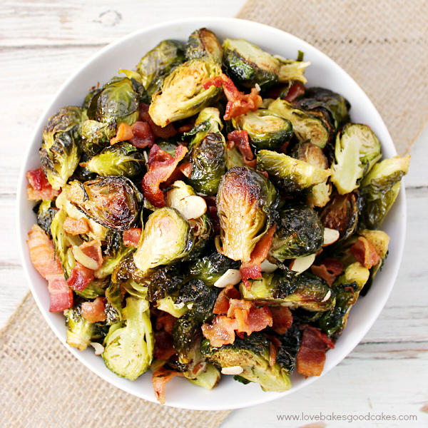 Roasted Brussels Sprouts with Bacon & Almonds in a bowl looking down into the bowl.