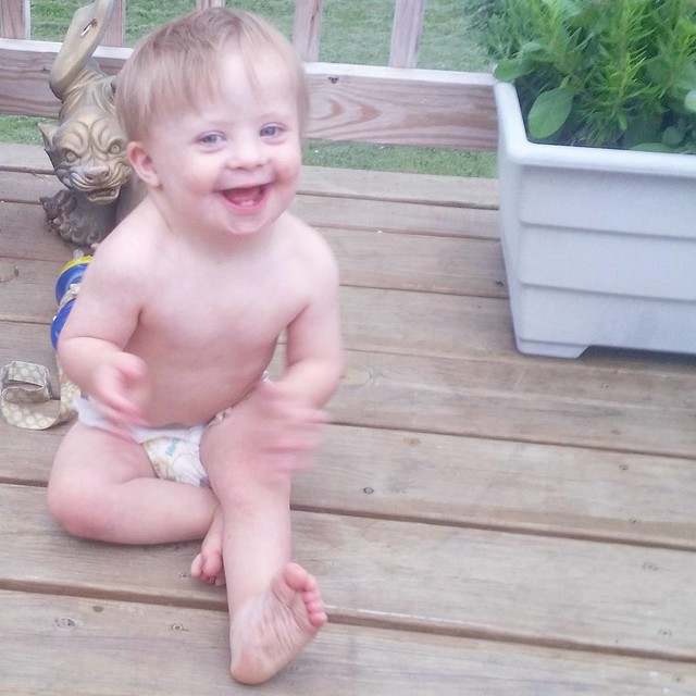I'm smiling because it's Friday. He's smiling because he's free of clothing! ❤ Kicking off this carefree weekend by hanging out on Nina and Papa's deck!