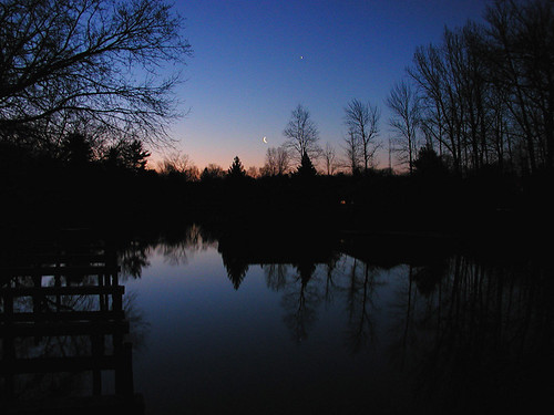 moon sunrise river leland michigan crescent