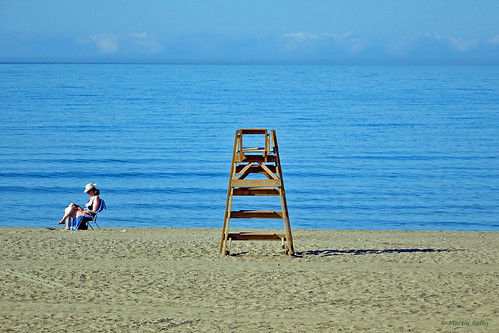 sea woman tourism beach lady mar spain chair mediterranean sitting view sony playa lifeguard scene tourist espana costadelsol sat sunbathing marbella andalusi rx10 dscrx10