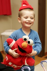 nick and his tickle me elmo doll 