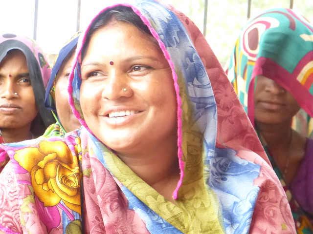 A beaming Sakubai talks about her village's water supply