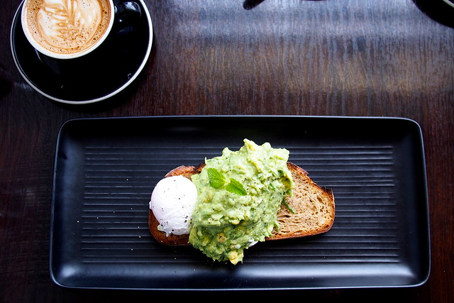 Flat White Coffee and Brunch in Melbourne - Dr. Jekyll Cafe (107-113 Grey Street, St. Kilda) - avocado and Meredith feta mash, with mint and lemon on rye toast, with a poached egg