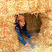 olivia hiding in a hay bale tunnel   dscf6656