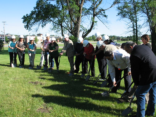 U.S. Dept. of Agriculture Rural Development State Director for Michigan James J. Turner (center, in brown suit) breaking ground for the Mt. Pleasant Native Farmers Market with Saginaw Chippewa Indian tribal leaders and local residents