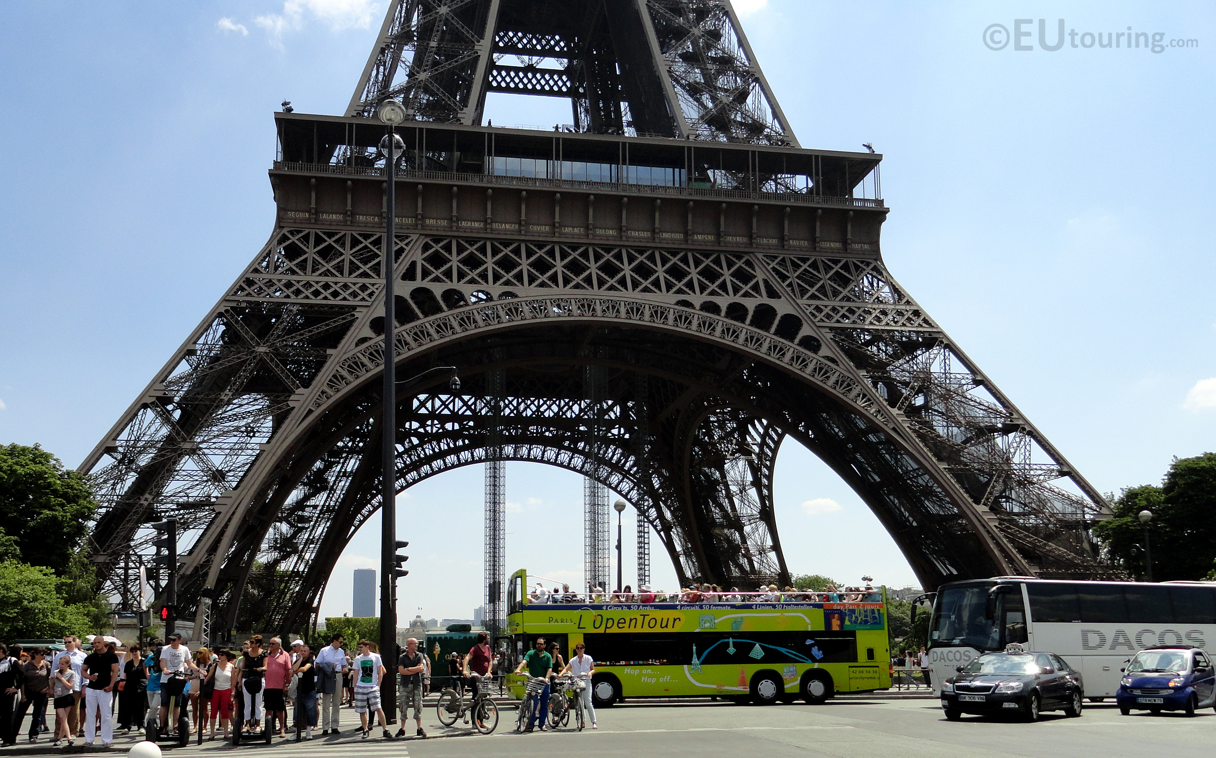 l'OpenTour bus in front of the Eiffel Tower