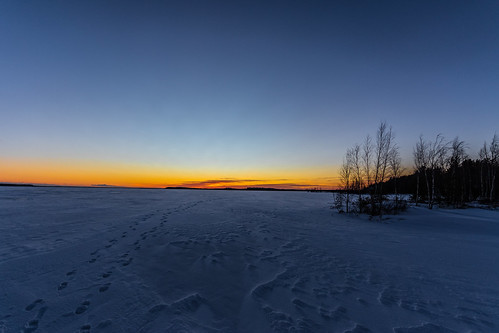 frosty evening icy lake snow lakescape hirvijärvi southern ostrobothnia finland sunset afternoon footprints canon eos 7d mkii wideangle sigma 1020 winter landscape light