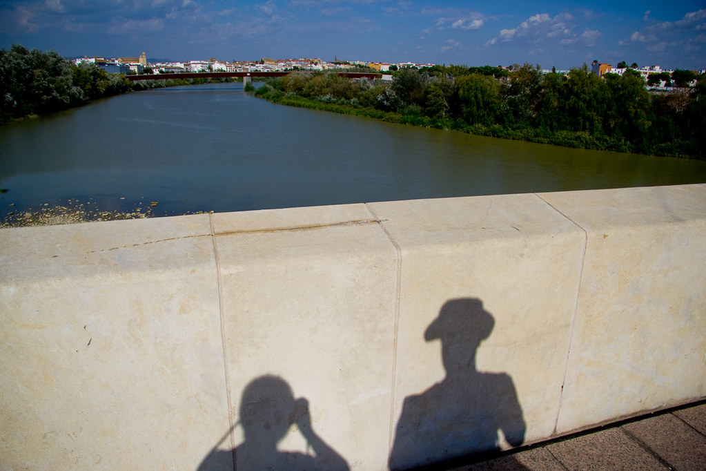 Our shadows while walking across the bridge