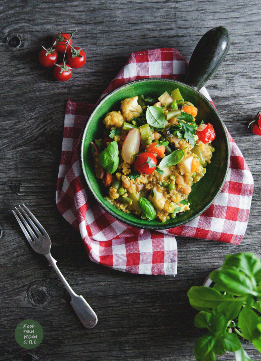 Vegan paella with summer vegetables and millet