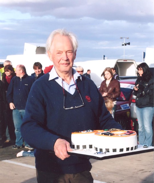 Michael Lindsay, championship co-ordinator for thirty years, celebrates the 60th year of his first visit to Silverstone with a cake provided by competitors.