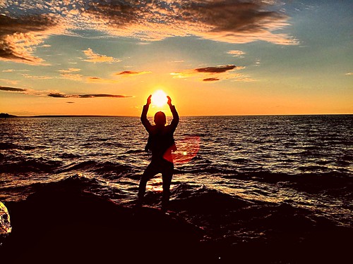 christmas sunset summer sun lake water girl up silhouette yellow sunrise outside outdoors photography rocks paradise michigan great perspective picture greatlakes burning catching upperpeninsula lakesuperior forcedperspective munising autrain picturesrocks mittenstate