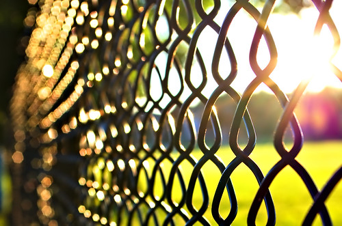 fence sunset repetition bokeh pentaxart cc0 darktable