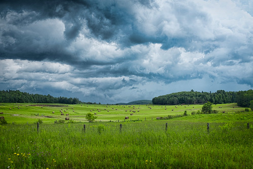 green field clouds fence pasture hay greenfield haybails dramaticclouds saintsixte x100s 2152015 215in2015 image87215