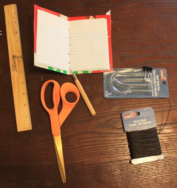 You can use an awl, a sharp pencil, a fork, or a hole punch to make it easier to sew your notebook together.