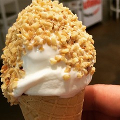 Have a #cone-olli at the #NutellaBar in #Eatalynyc.  Your choice of #gelato atop a #nutellafilledcone, rolled in #roastedhazelnuts.  #yummy ! #foodporn #icecream #Itsliansdoitbetter #musttry #lovedit #dessert inNewYork #FlatIronDistrict