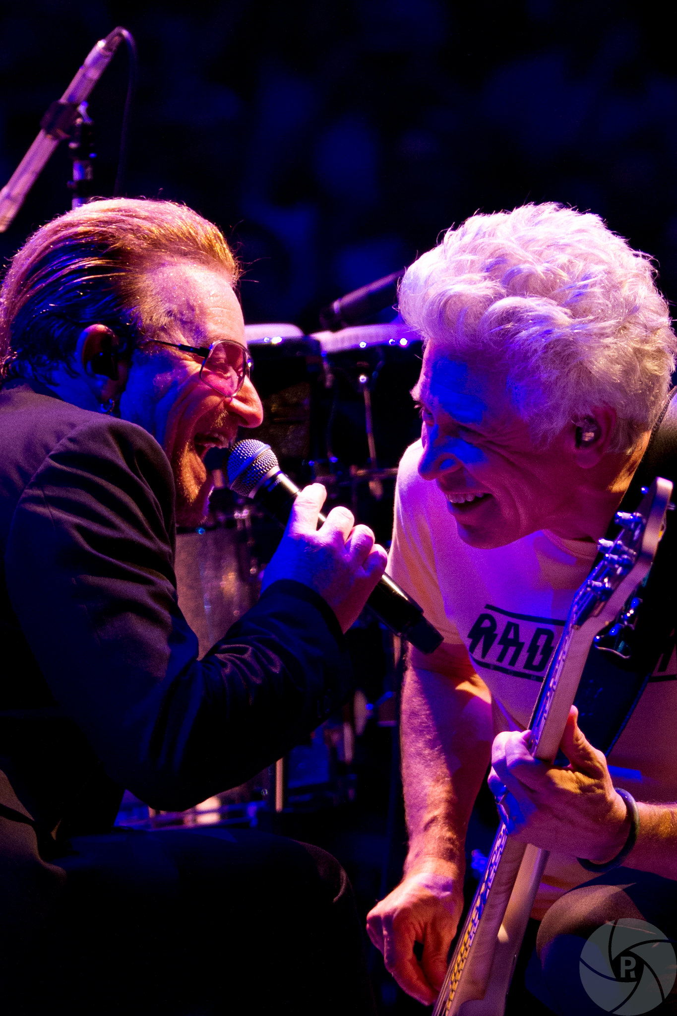 Bono and Adam laughing